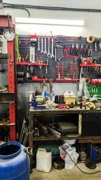 Busy workbench with various hand tools, wrenches, Stock Photos