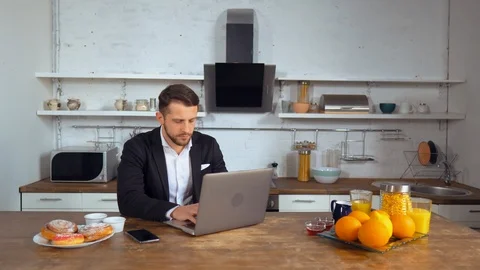 Busy worker uses his laptop before working day Stock Footage 112095646