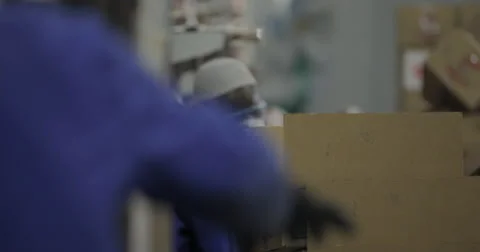 Busy Workers At The Soap And Detergent Factory Packing Products (4K) Stock Footage 60937642
