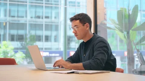 Busy young business man using laptop working in modern office. Stock Footage 272150349