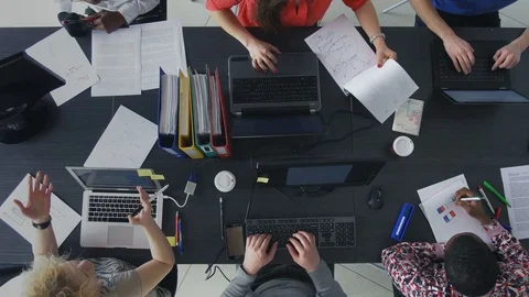 Busy young professionals communicating and analyzing the data Stock Footage 73849663
