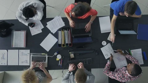 Busy young professionals working and analyzing the data Stock-Footage 73849709