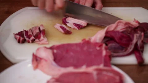 Butcher in action - chopping side steak with sharp knife Stock Footage 44727122