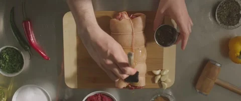 Butcher binds meat rolled up for pochette marinated roast pork, Culinary show Video stock 288144994