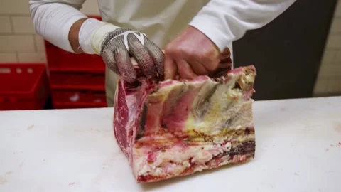 Butcher carving dry aged beef Stock Footage 152034892