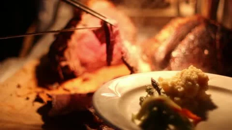 Butcher chef cutting and serving cooked roast 스톡 동영상 18092590
