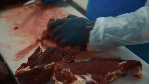 The butcher cut up the carcass. Close up. Stock Footage 87137703