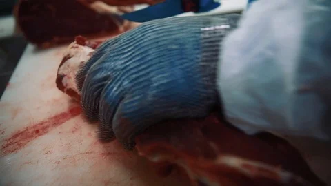 The butcher cut up the carcass. Close up. Stock Footage 87137751