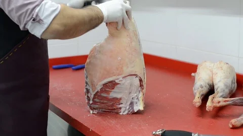 Butcher cut up the carcass of fresh meat Stock Footage 80715249