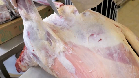 Butcher cut sheep meat. Make a sacrifice of a sheep on Kurban bayram. Stock Footage 125011652