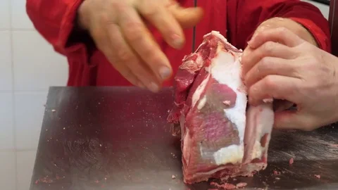 Butcher cuts beef steaks with electric saw Stock Footage 85311925