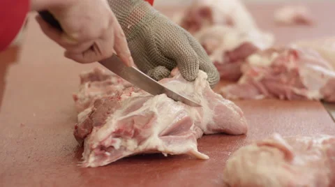 Butcher cuts meat Stock Footage 63840132