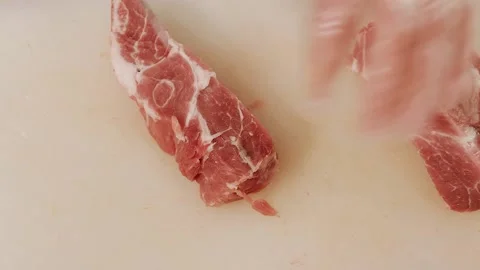 The butcher cuts the meat Stock Footage 158741027