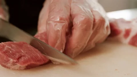 The butcher cuts the meat Stock Footage 158741030