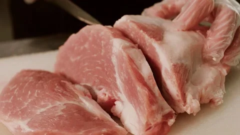 The butcher cuts the meat Stock Footage 158741032