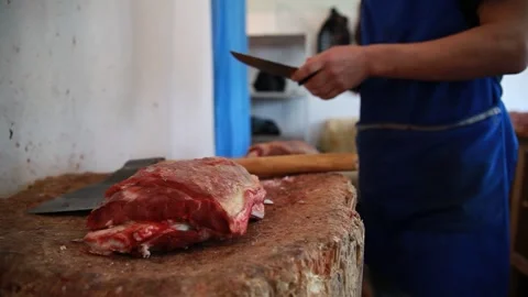 The butcher cuts the meat. Stock Footage 244209718