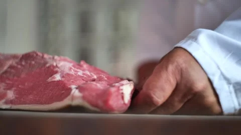 Butcher Cuts The Meat Video stock 250553451