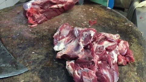 Butcher cutting lamb meat Stock Footage 119473119