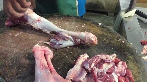 Butcher cutting lamb meat Stock Footage 119473484