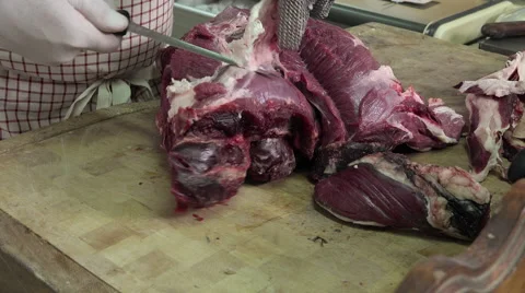A butcher cutting meat cubes Video stock 55754871