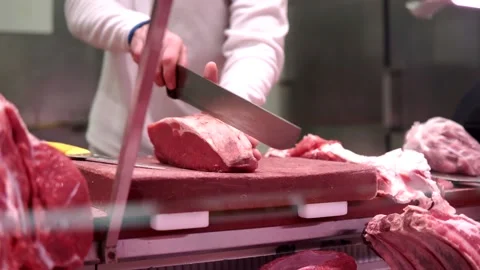 Butcher cutting a piece of meat Stock Footage 170905602