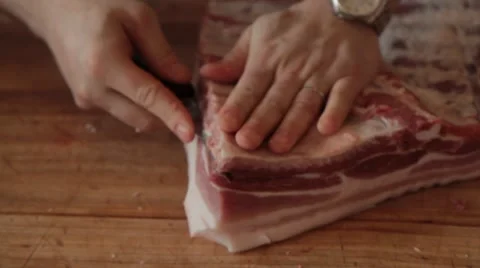 Butcher cutting pork 2 Stock Footage 42230287