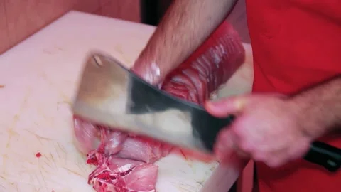 Butcher Cutting Pork Chops With Meat Cleaver Stock Footage 200837312