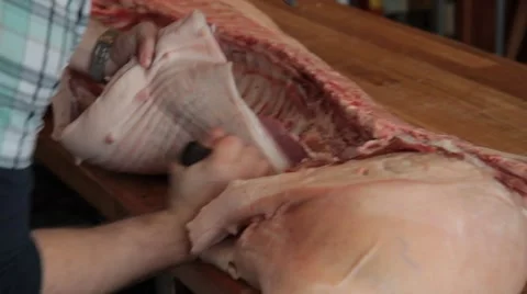 Butcher cutting pork Stock Footage 42230748