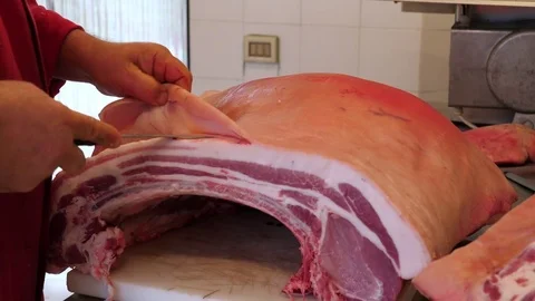 Butcher cutting pork meat on the table. Stock-Footage 84773449