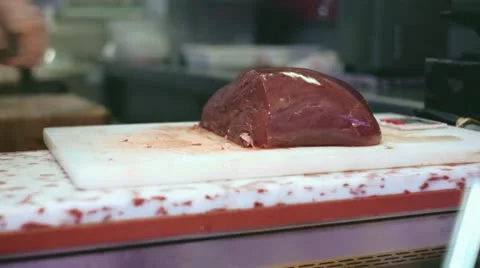 Butcher cutting raw meat Stock-Footage 21242378