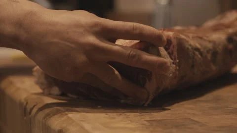 Butcher Cutting Raw Meat in Handheld Close-Up Inside Butcher Shop Stock-Footage 323741297