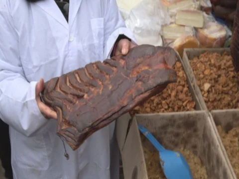 Butcher holding a meat bacon table Stock Footage