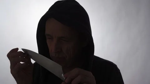 The Butcher, killer holding a big kitchen knife. Stock Footage 239298779