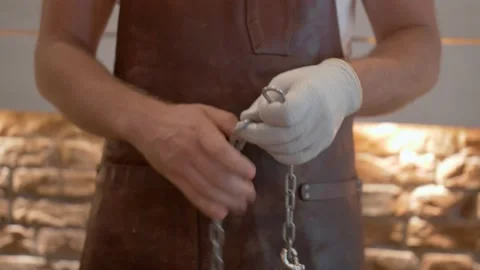 Butcher in a Leather Apron with Tool Chain Stock Footage 137899841