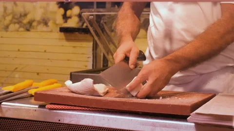 Butcher man work on meat preparation in traditional raw city market, street food Stock Footage 253311158