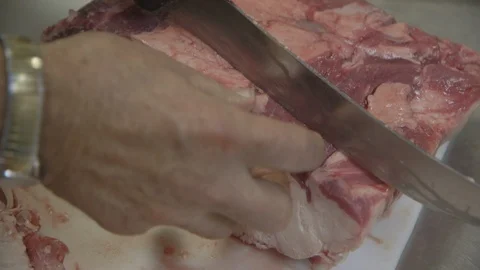 Butcher portioning fillets of beef Stock Footage 104872864