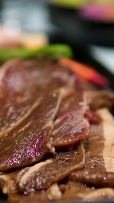 Butcher prepares beef slices, close up Stock Footage 302819257