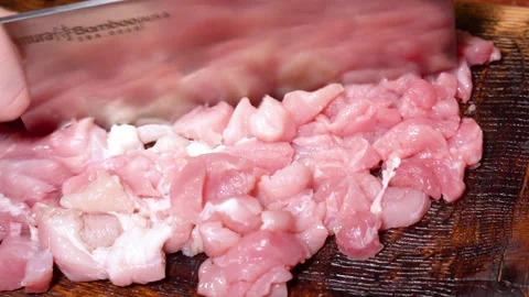 Butcher prepares cuts of pork Stock Footage 252123642