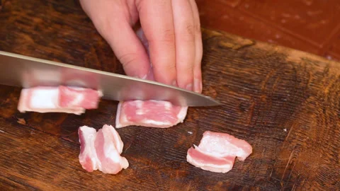 Butcher prepares cuts of pork Stock Footage 255398913