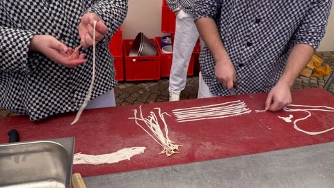 Butcher preparing casing for white pudding Stock-Footage 86192771