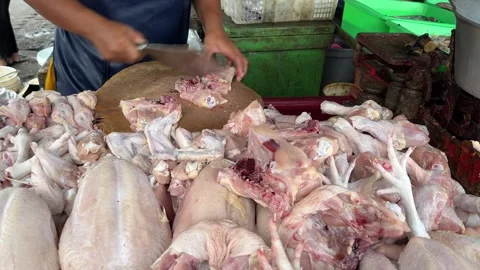Butcher preparing chicken meat in a local market Stock Footage 274040835