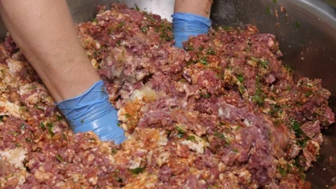 Butcher preparing ground meat mixture with spices Stock Footage 331248222