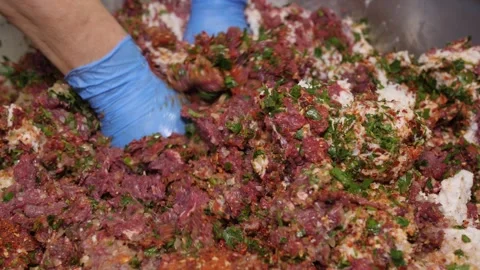 Butcher preparing minced meat mixture for sausages Stock Footage 331248217