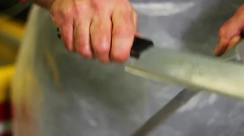 Butcher sharpens knives Stock Footage 38840608