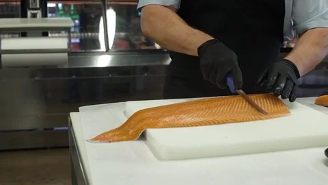 Butcher slicing a fresh fish Stock Footage 83457397