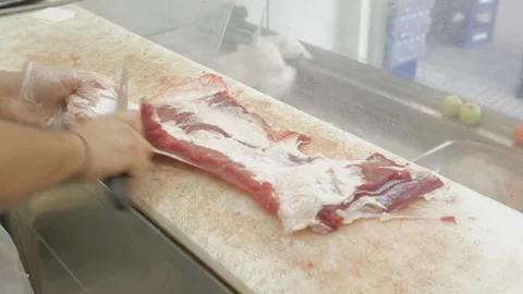 Butcher slicing meat Stock Footage 171229891