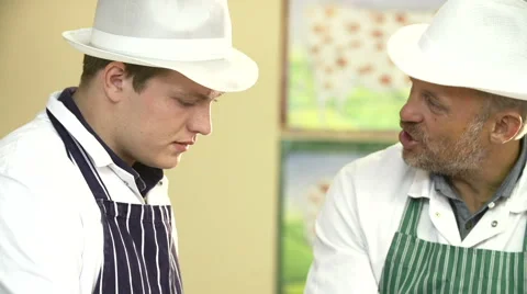 Butcher Teaching Apprentice How To Prepare Meat Video stock 40431557