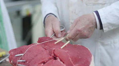 Butcher Tying Up Meat With String Stock Footage 55826231