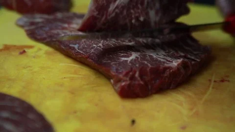 Butchering meat with a knife Video stock 73492053
