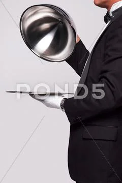 Butler and silver service Stock Photos